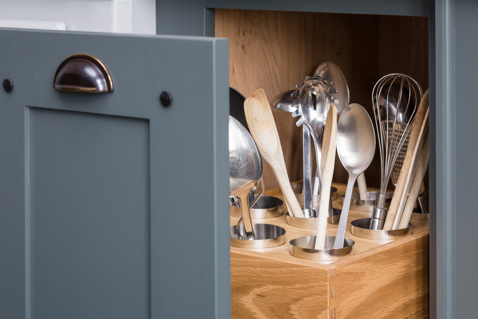 kitchen gadgets placed inside their holders in the drawer