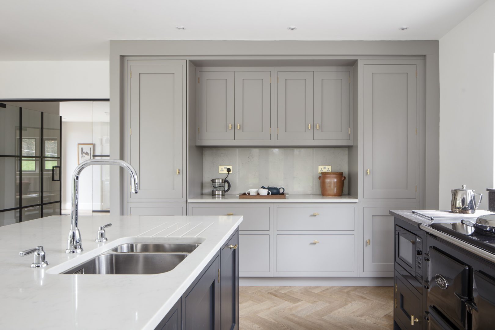 handmade shaker kitchen with a kitchen island in shades of grey