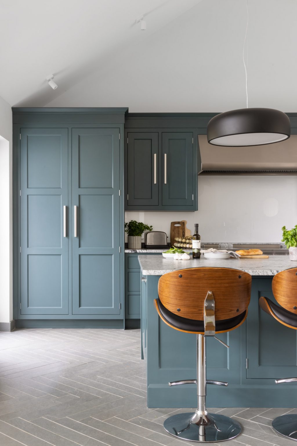 large blue island with a granite worktop in blue kitchen colour